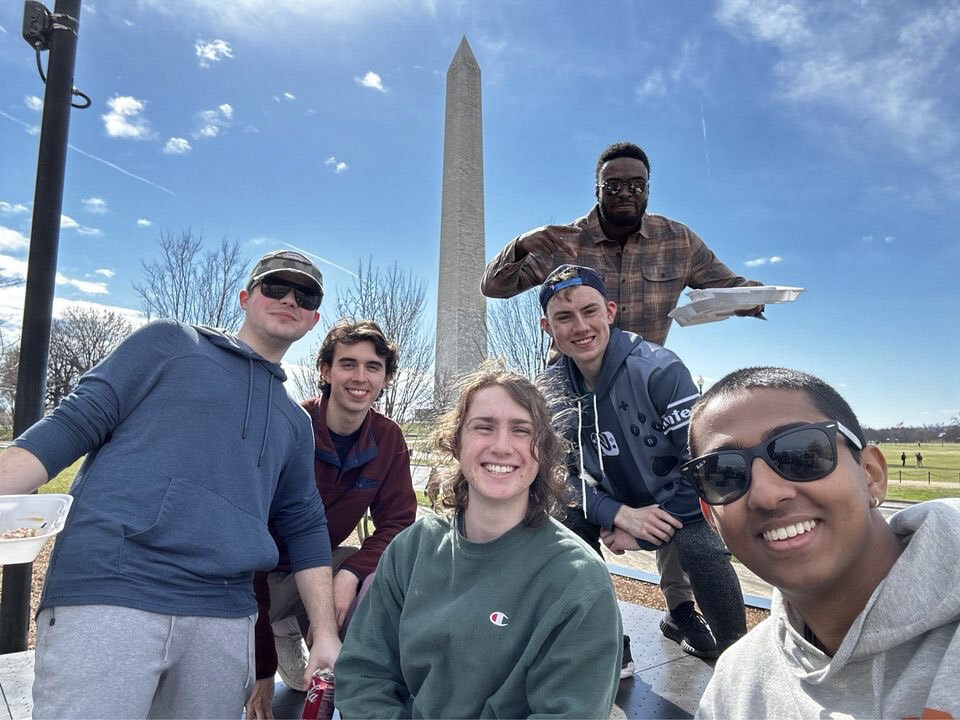 students outside with washington monument in background