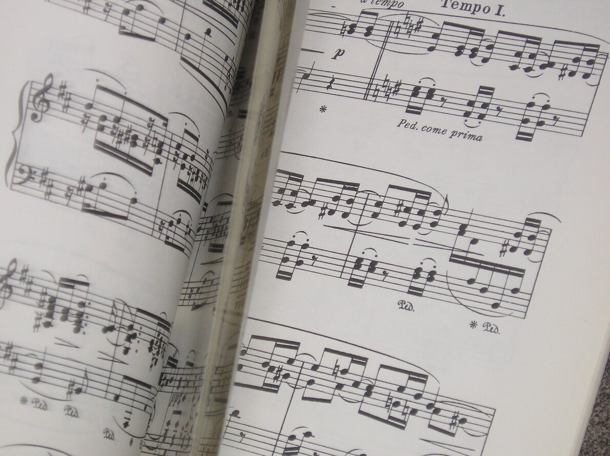 pieces of sheet music in motion