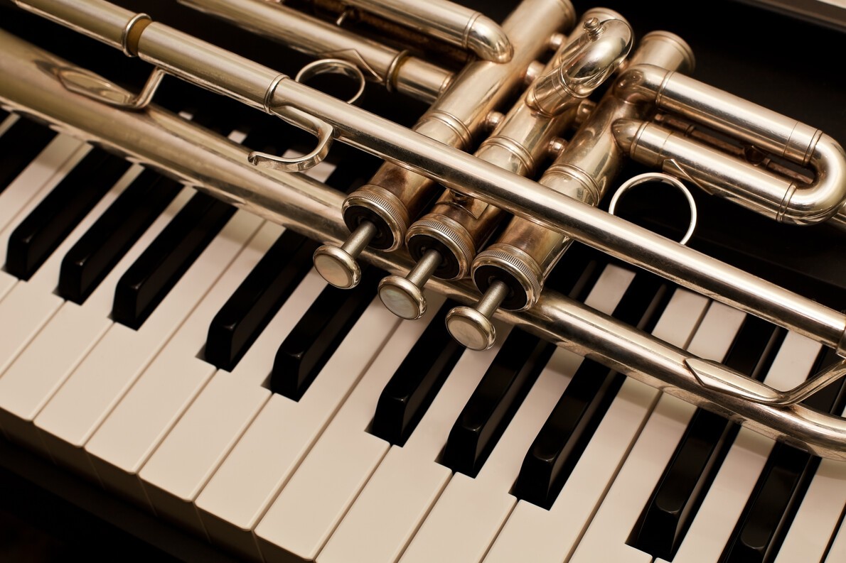 trumpet on piano keys