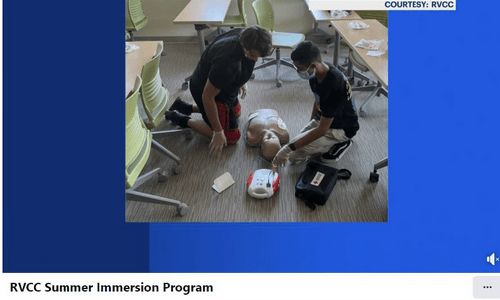 news 12 image of students doing cpr on manequin torso
