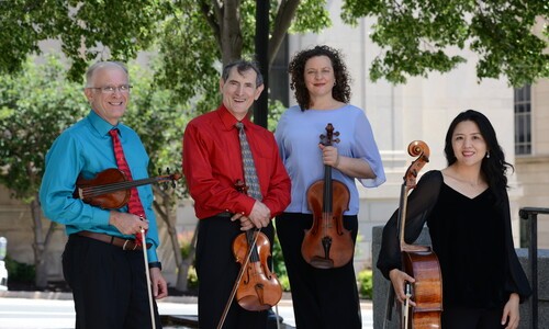 copland string quartet members with instruments outside