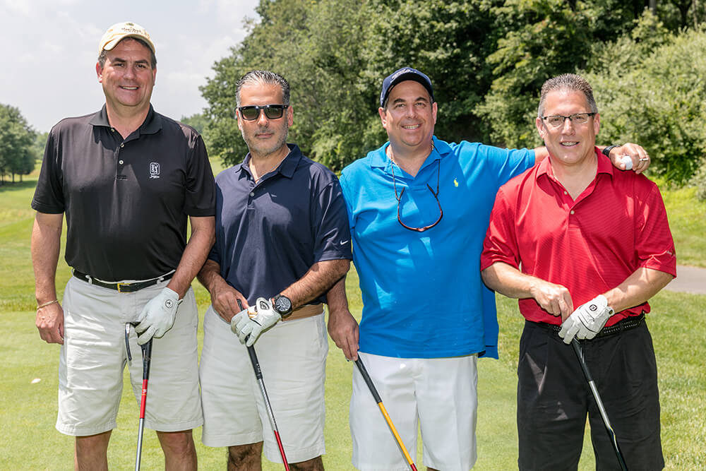 four golfers with Mike LaMotta