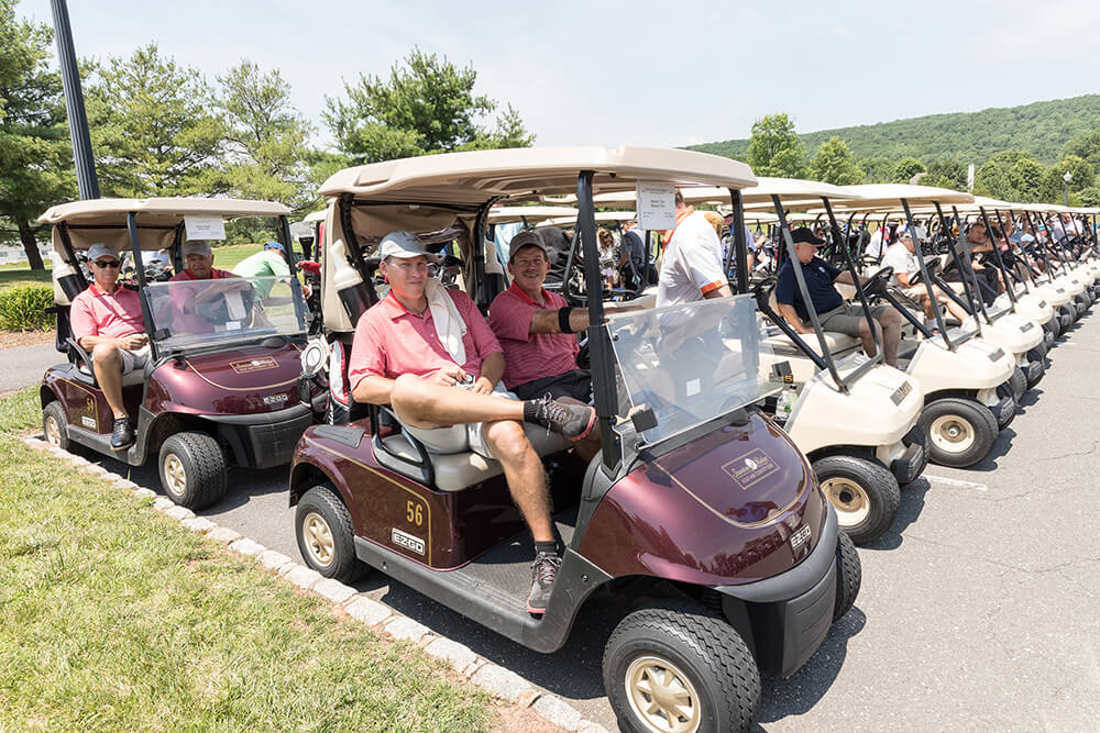 golfers in golf carts