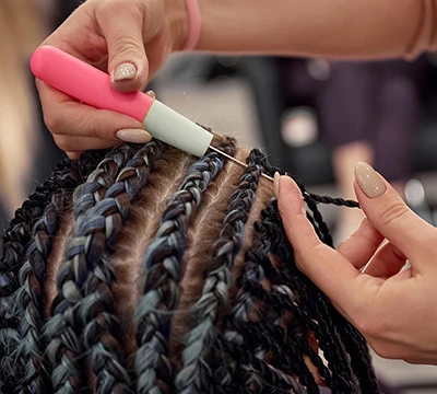 close up of hair braids being applied