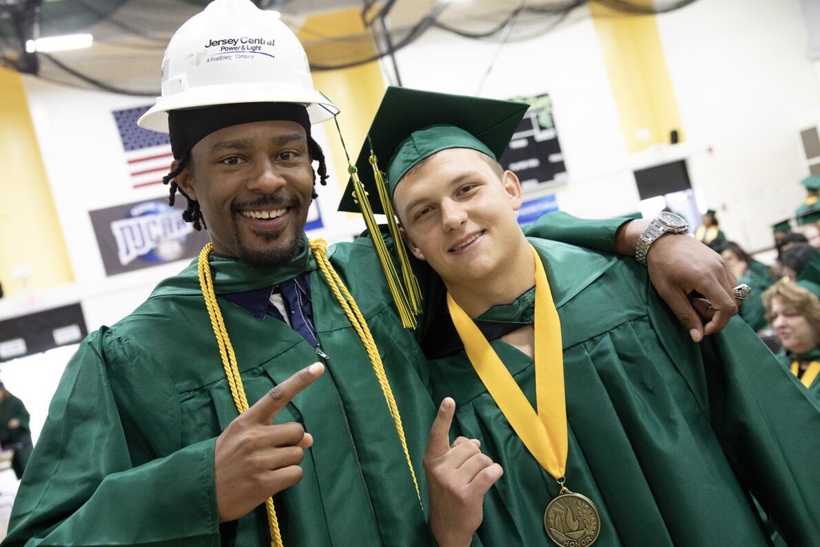 grad with hard hat and grad with medal