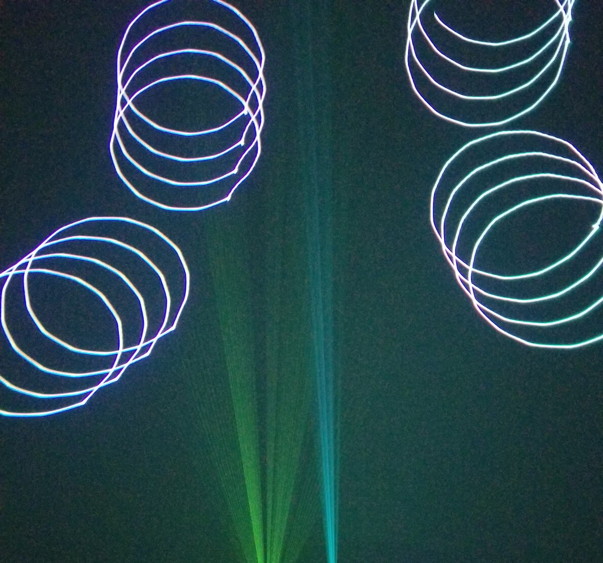 laser image with green and cyclinder-like swirls