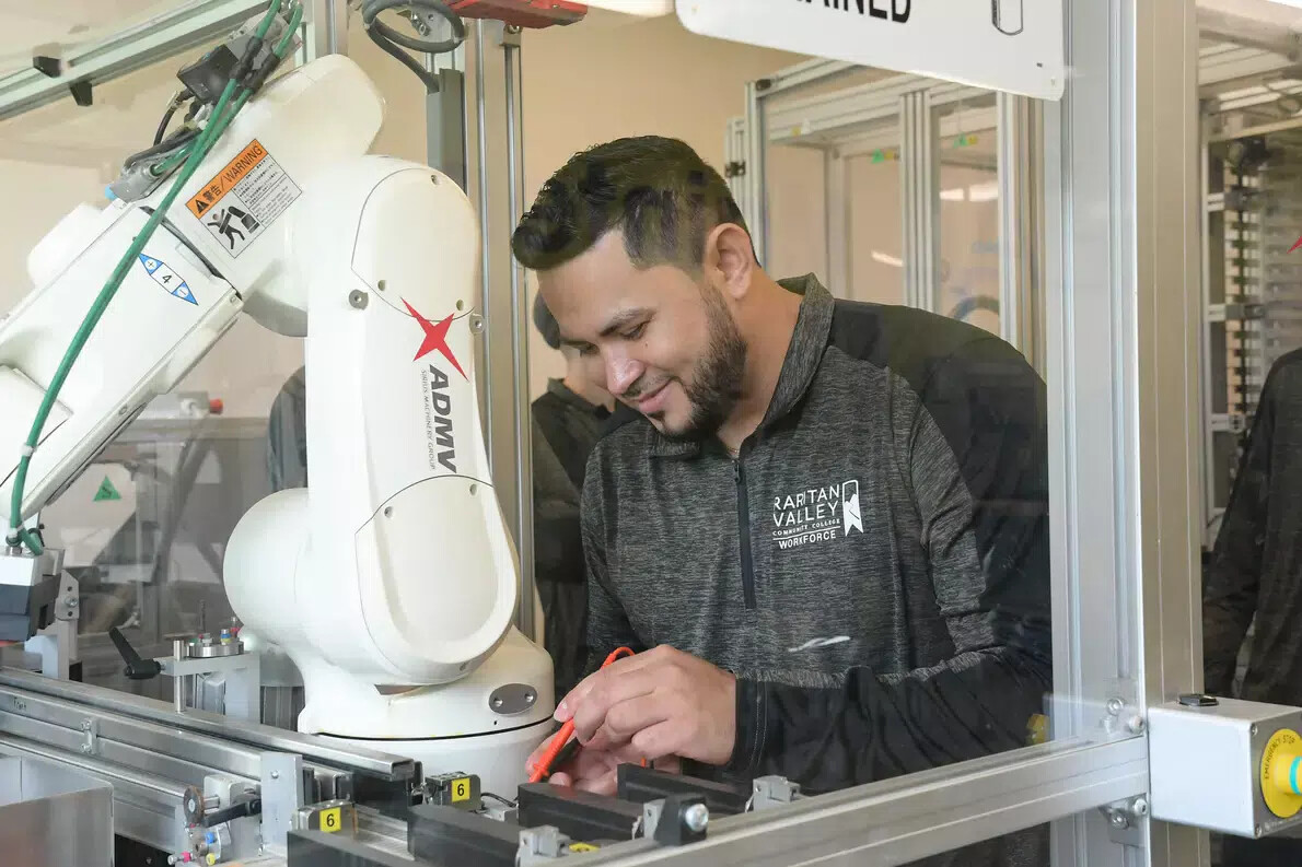male student working on equipment