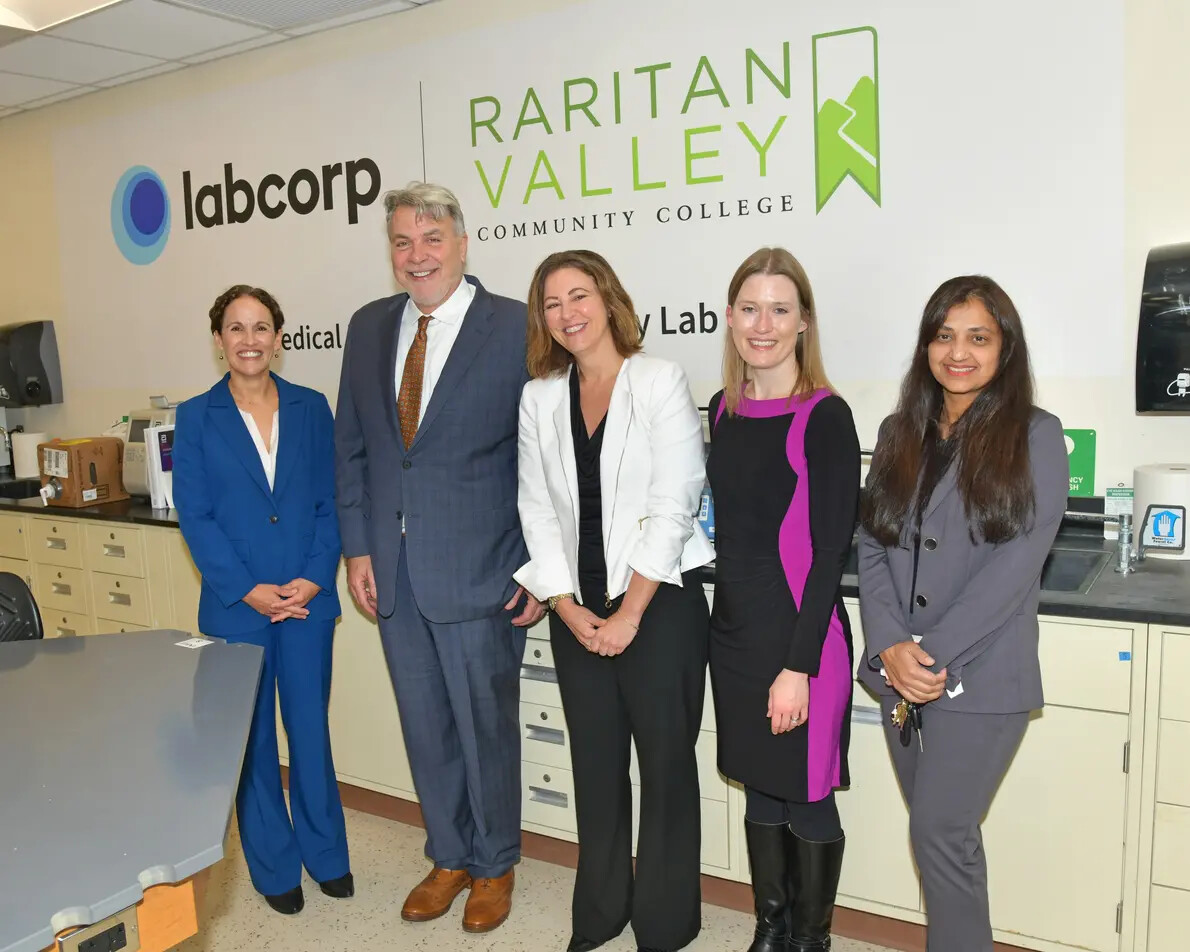 5 people in rom with labcorp and rvcc signs