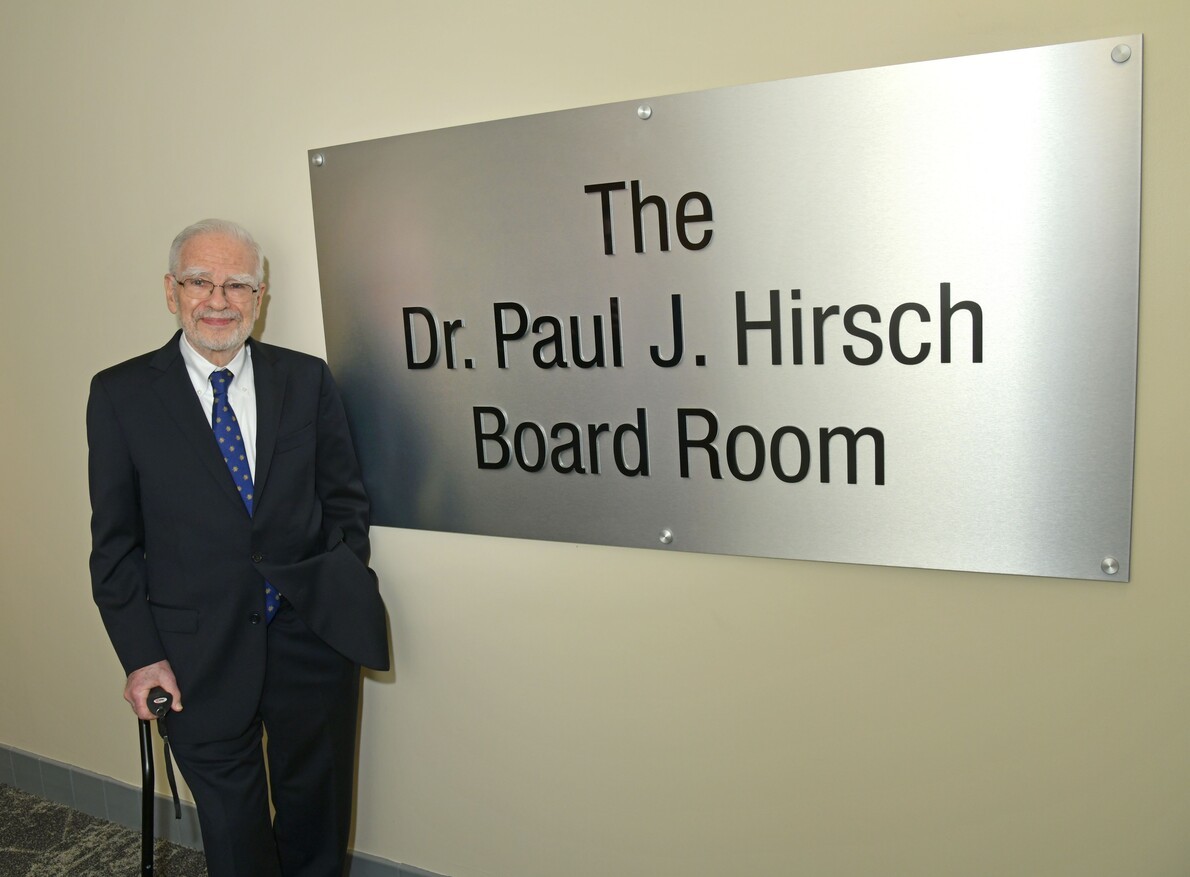 paul hirsch with sign with his name