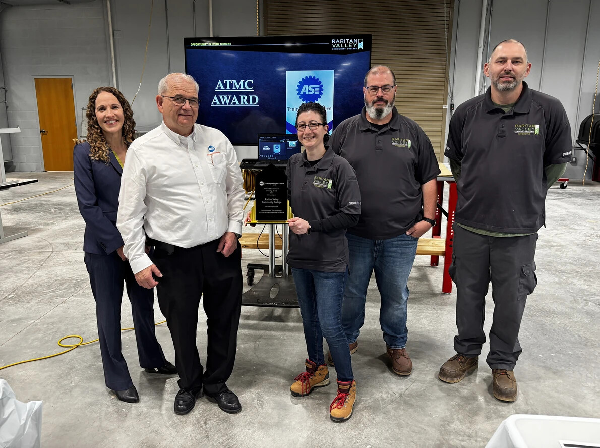 sara heller with award and four others
