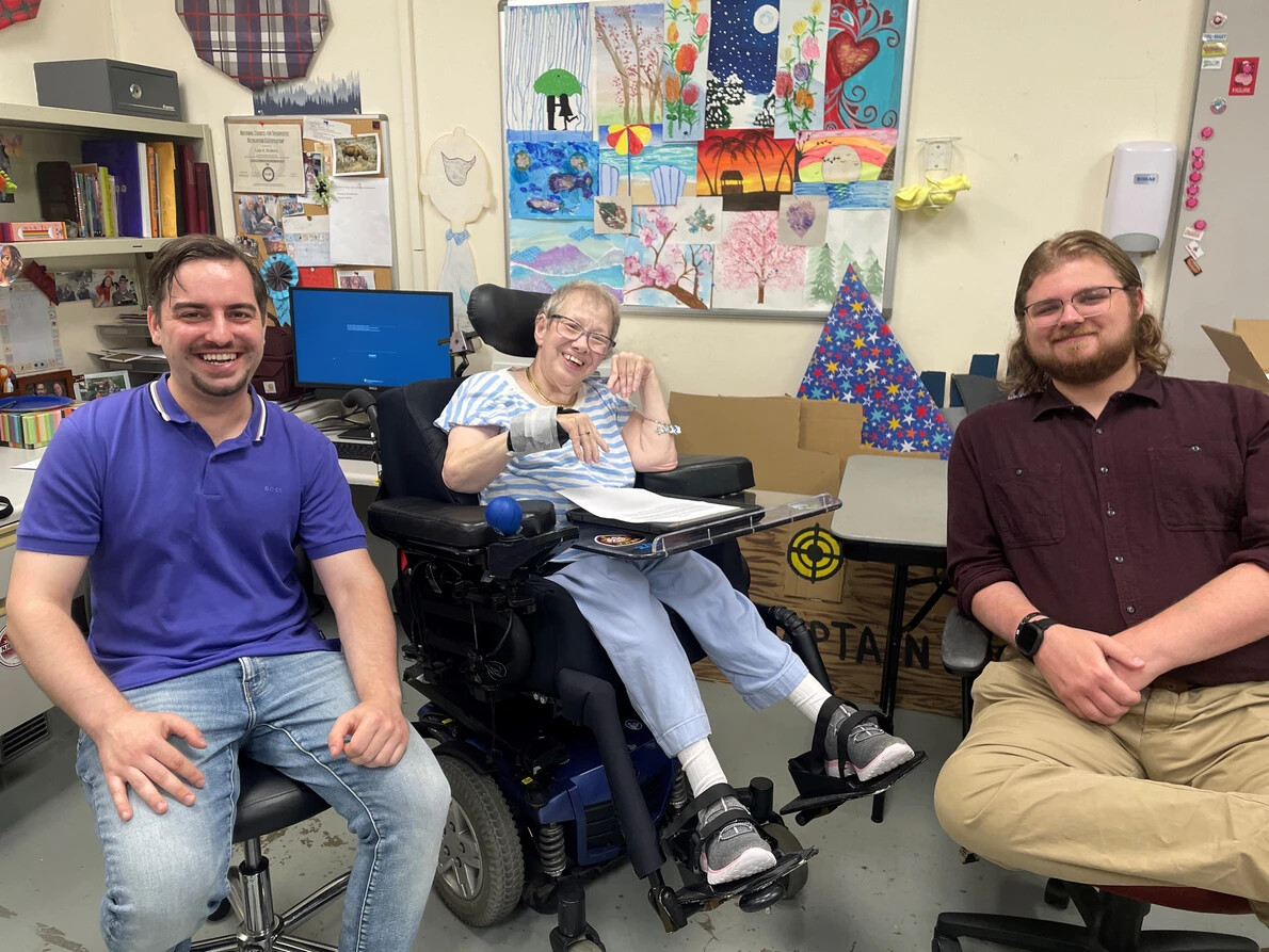 matheny artist in wheelchair with 2 students