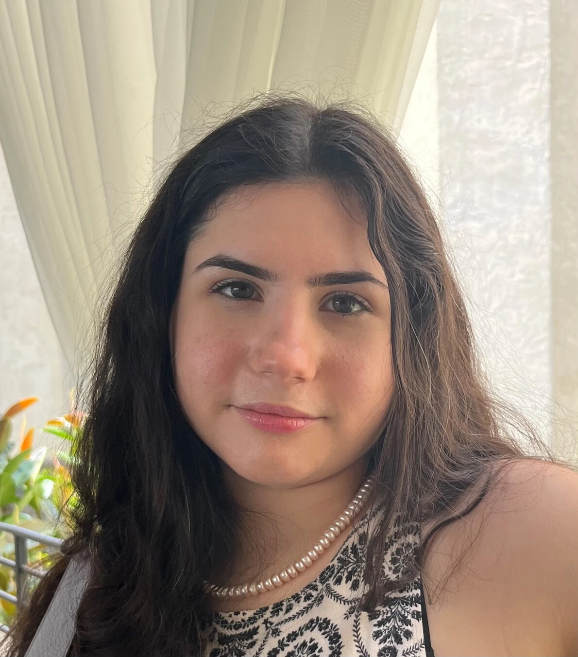 lila seroy wearing pearls