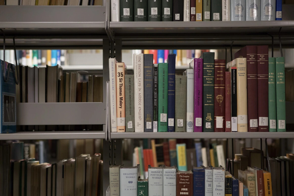 book shelves with books at library