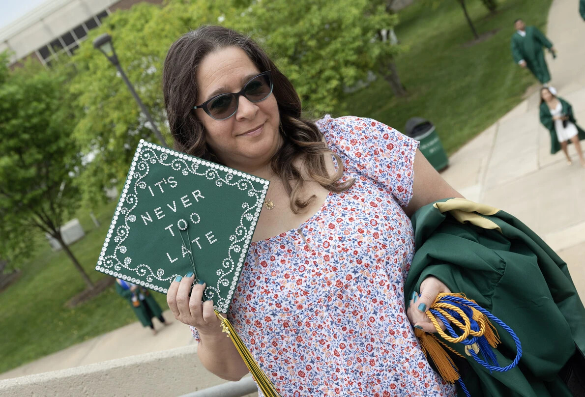adult grad with it's never too late on cap