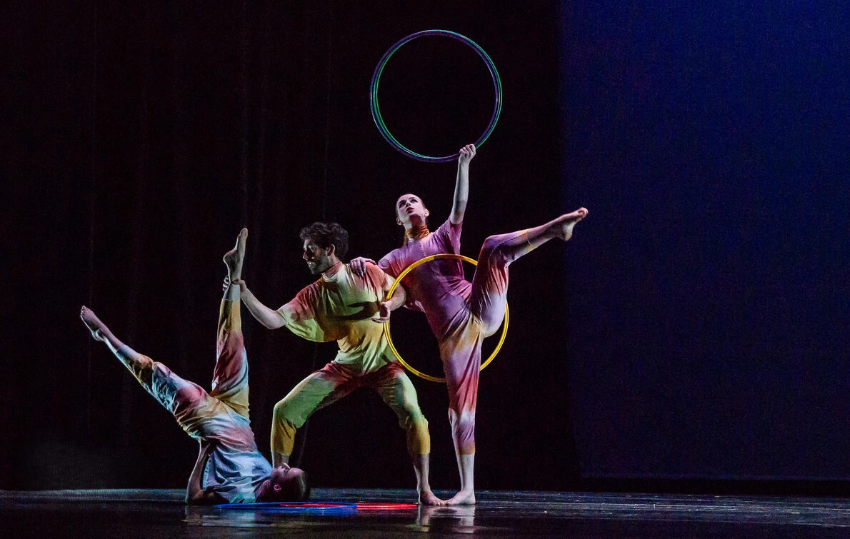 three dancers with hula hoop