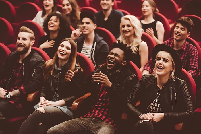 audience members laughing