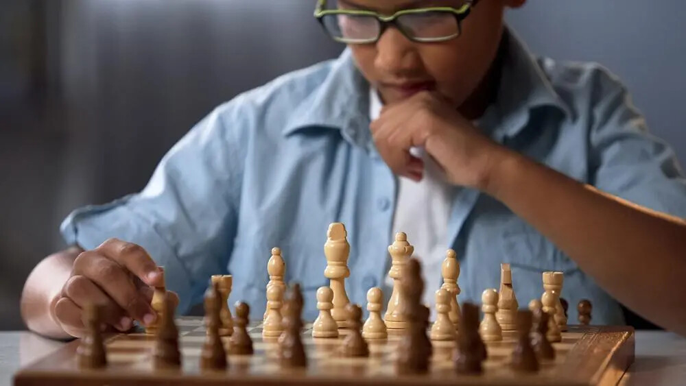 boy playing chess