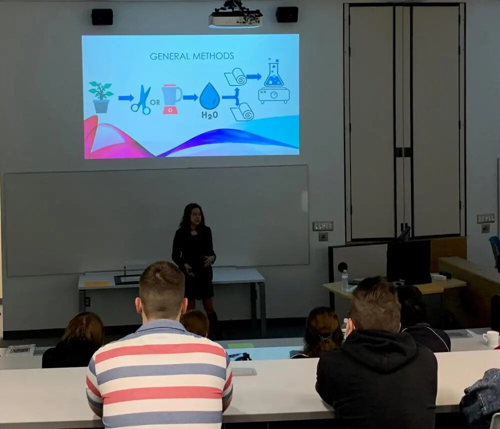 female student speaking to group
