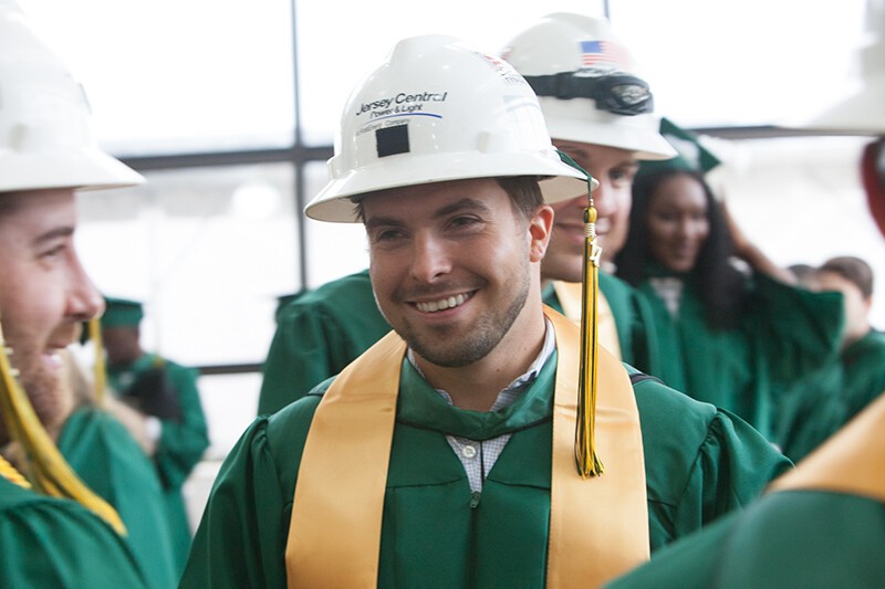 graduates in hard hats