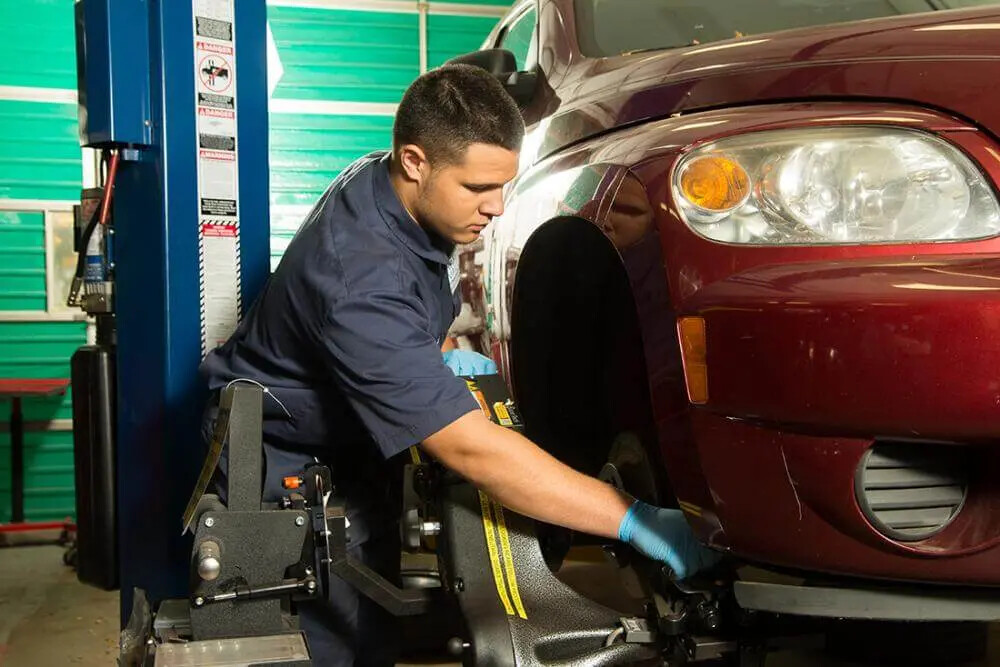 student working on car