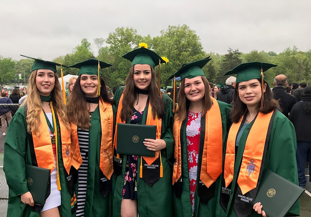 row of female honors college grads