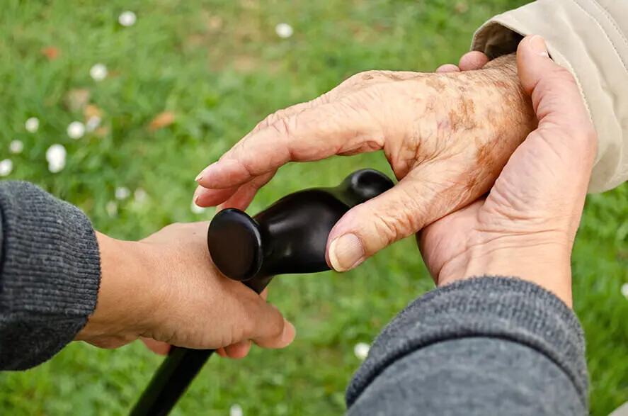 helping older hands on cane