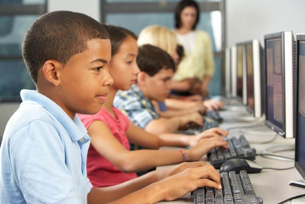 kids typing on computers