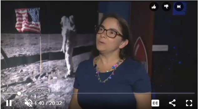 amie gallagher with moon landing photo