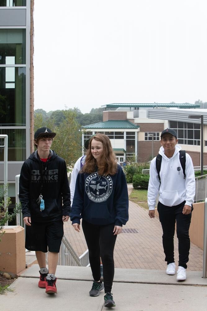four students outside with one female