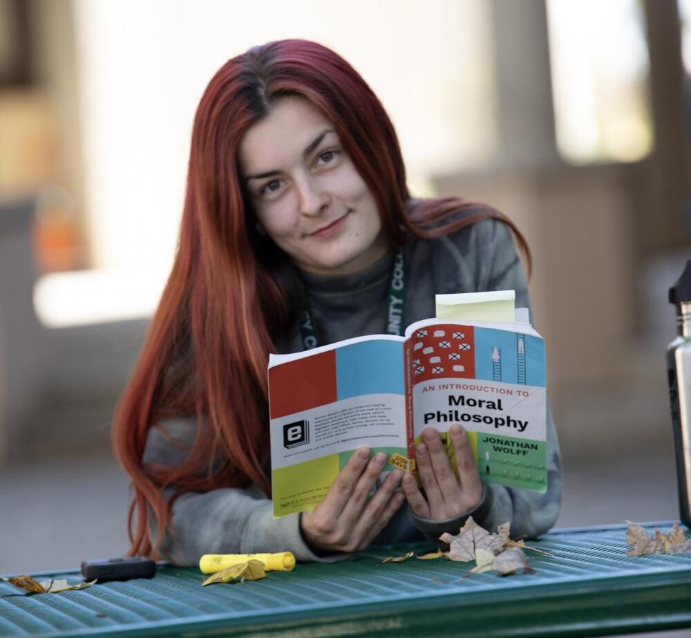 red-haired girl with moral philsophy book