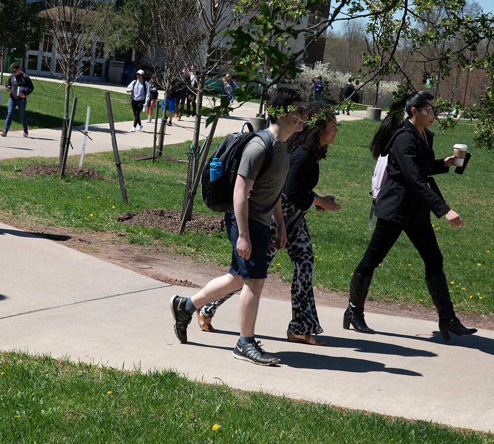 students walking on campus in springtime
