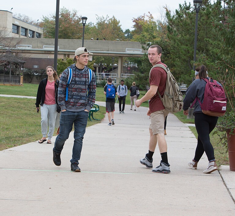 students walking outside on path