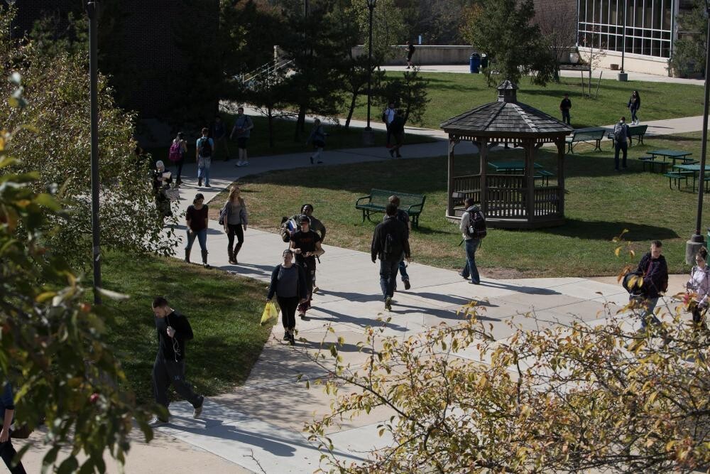 many students walking outside on campus