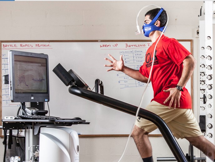 man wearing helmet on treadmill