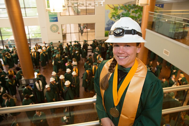 female graduate in hard hat
