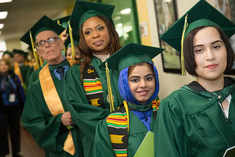 diverse group of 4 grads