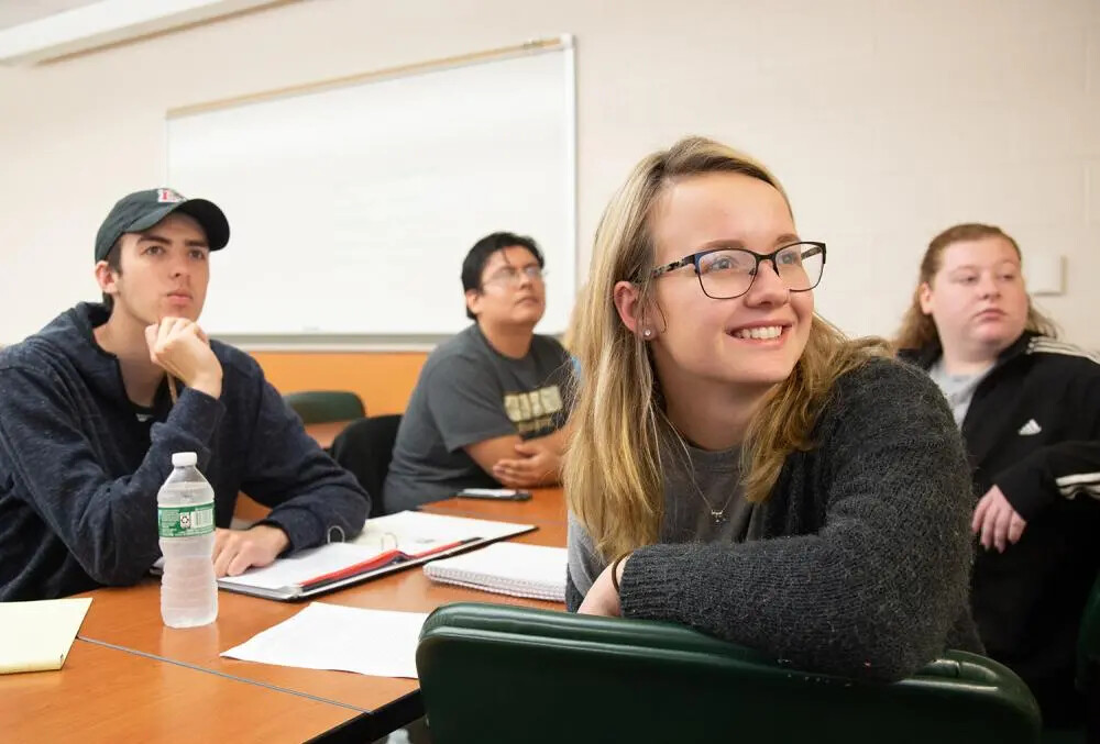 four students in a classroom