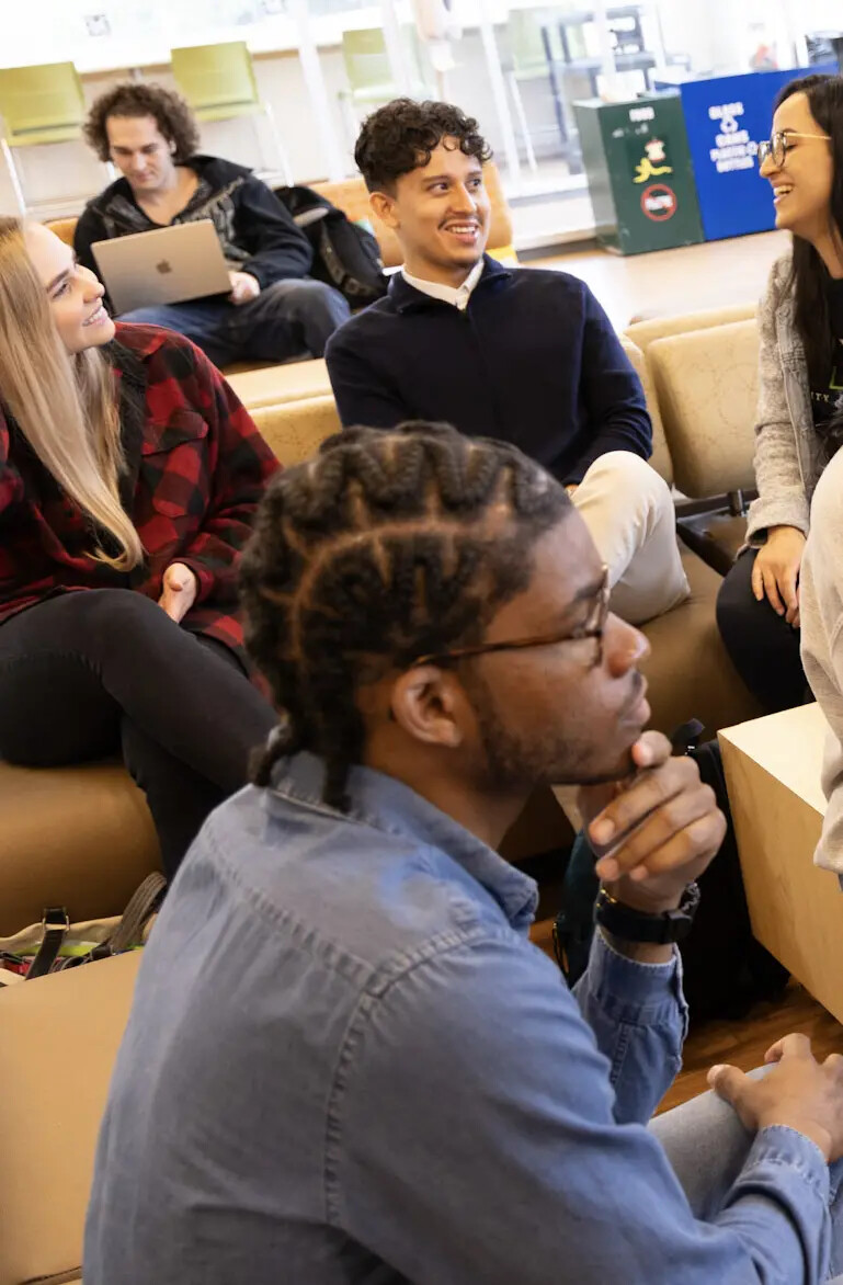 group of students between classes relaxing