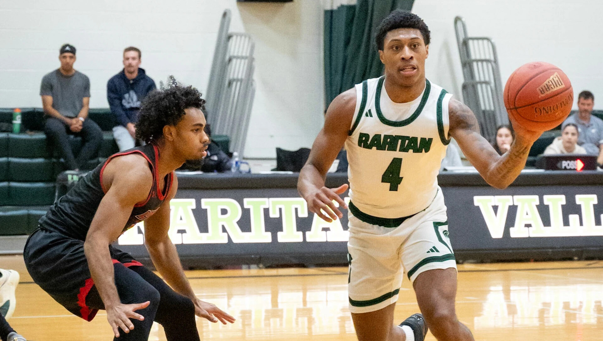 two mens basketball players in action