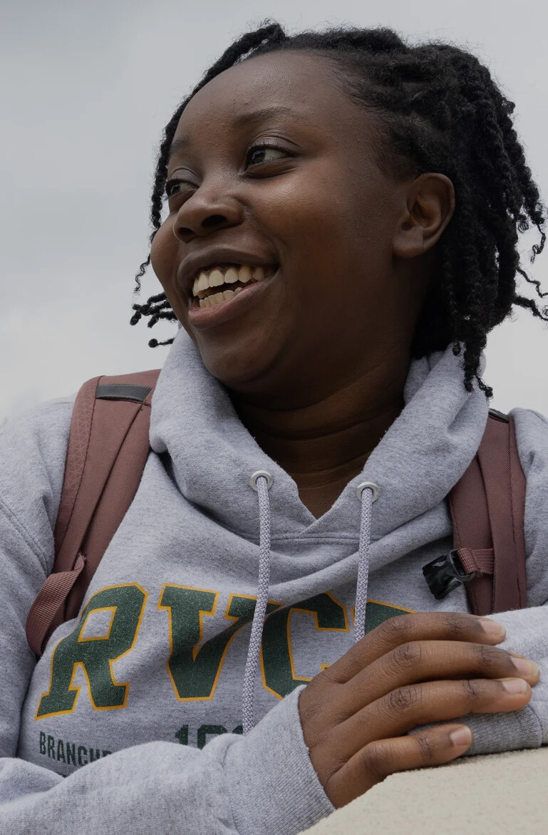 Student outside in RVCC sweatshirt