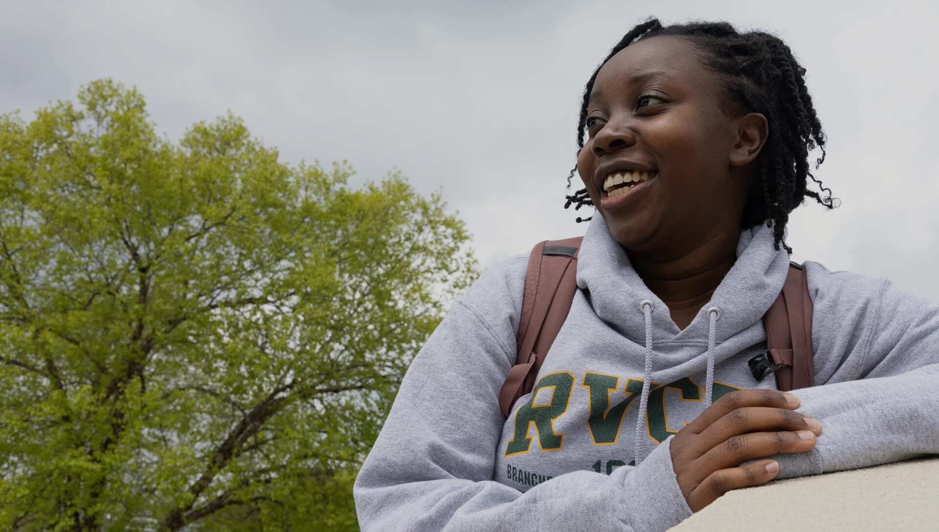 Student outside in RVCC sweatshirt