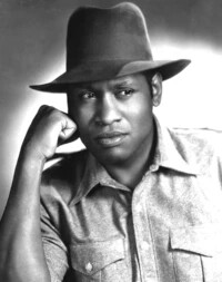 Paul Robeson posing while in costume for an acting role.