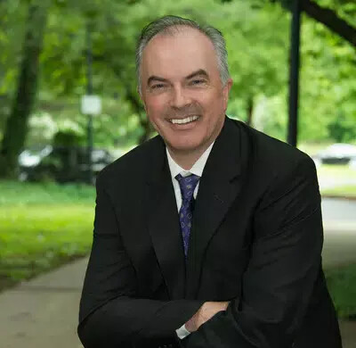mike mcdonough outside with arms folded
