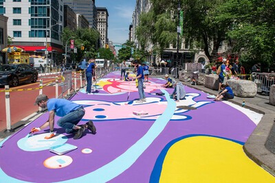 artists working on street mural