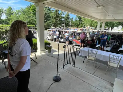 female student about to sing national anthem