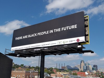 black background billboard with white letters