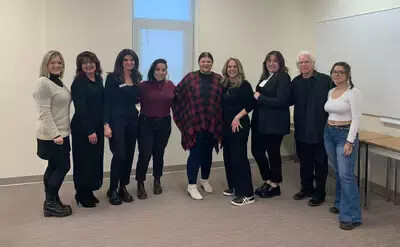 cosmetology students in lineup with beauty professionals