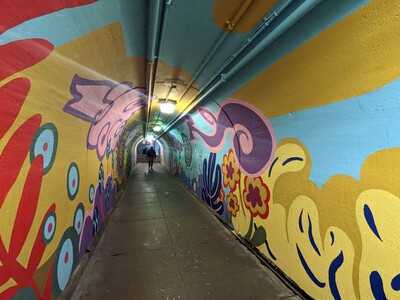 tunnel mural with swirls of color
