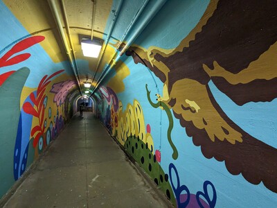 tunnel mural with bird image on right