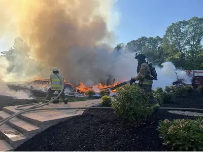 2 firemen fighting a fire